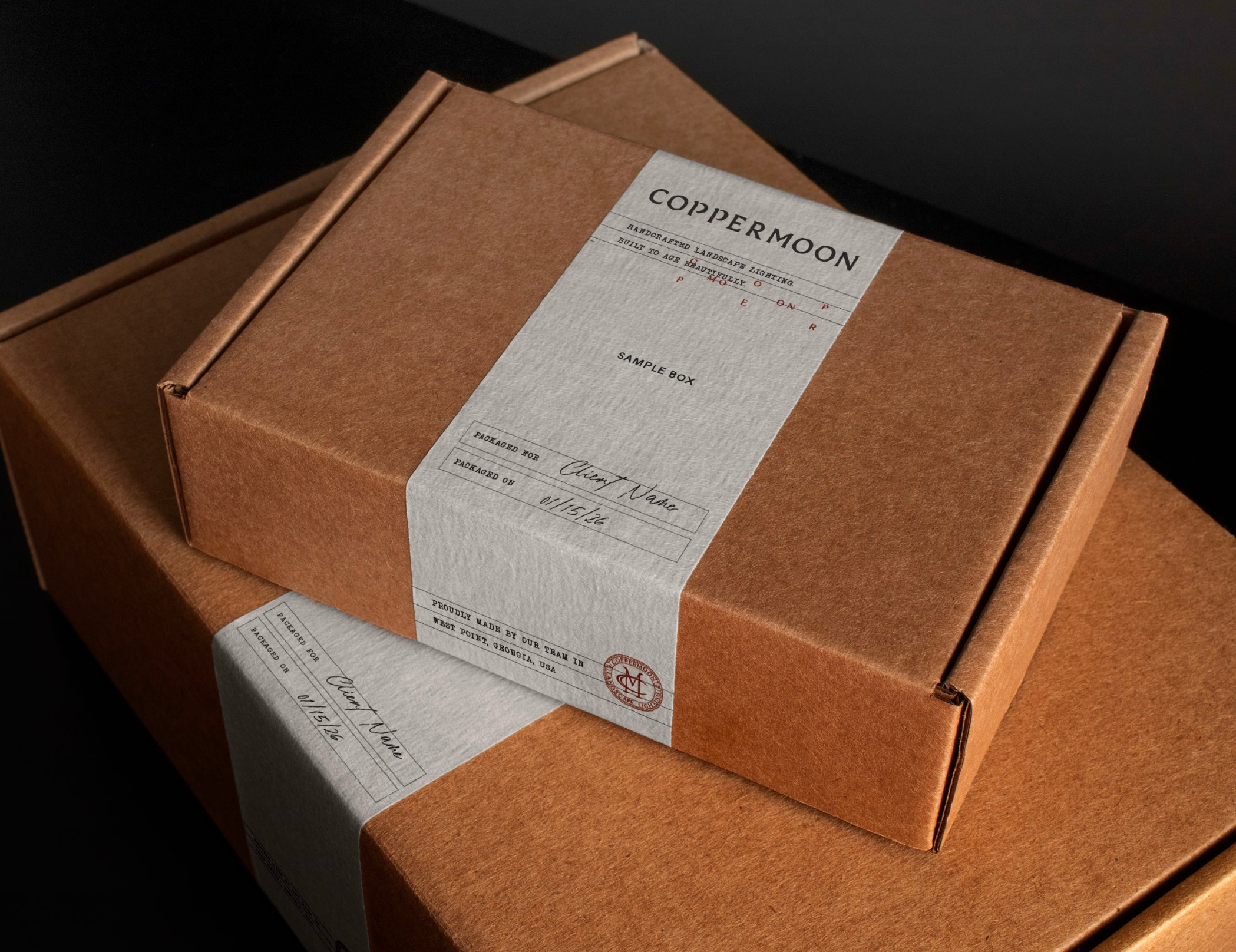 CopperMoon branded kraft sample boxes with hand-stamped letterpress labels
